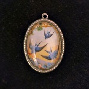 Oval Pendant with Bird Design Charm
